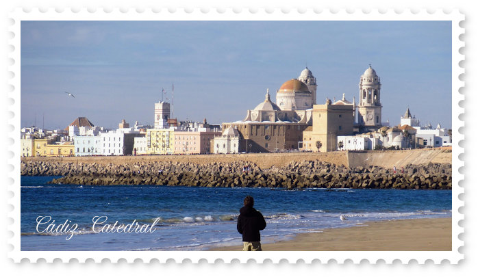 Cadiz from the beach with sea and cathedral