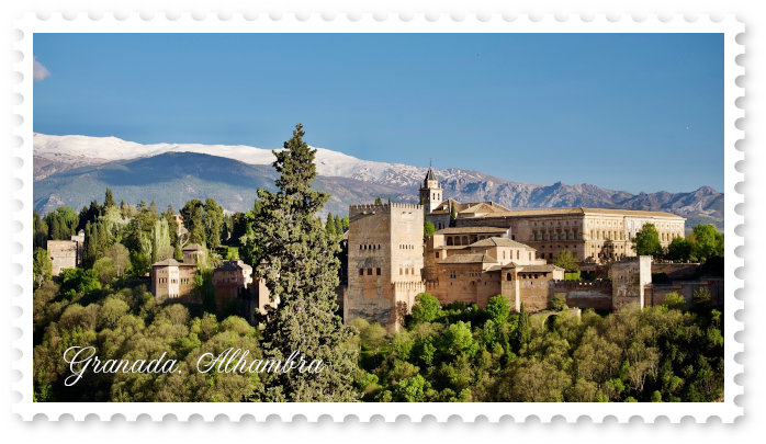 Alhambra de Granada in the sun with the Sierra Nevada in the background