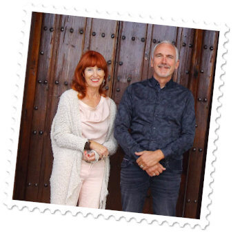 Marita and Malcolm in front of a house entrance
