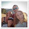 Photo in fom of a stamp of happy family with kids