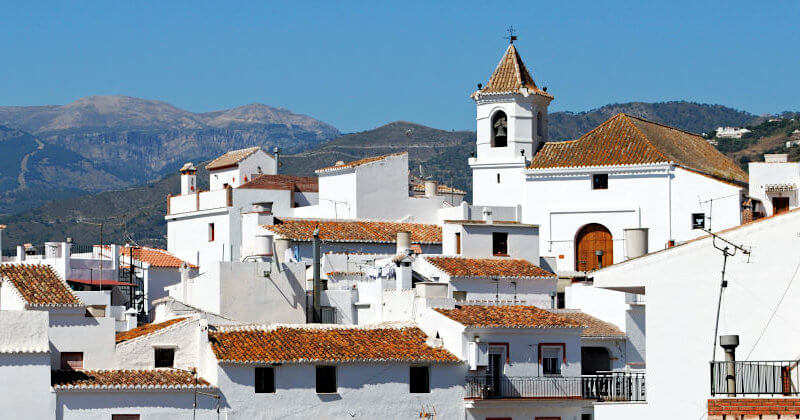 The church and roofs of Competa and the mountain Maroma in the back